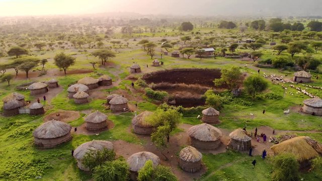 Aerial Drone Shot. Traditional Masai village at Sunset time near Arusha, Tanzania.