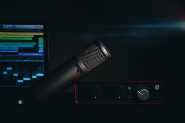 Audio recording basic set-up with a professional condenser microphone, audio interface and a...