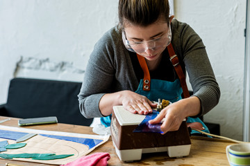 Processing elements of colored glass for stained glass.