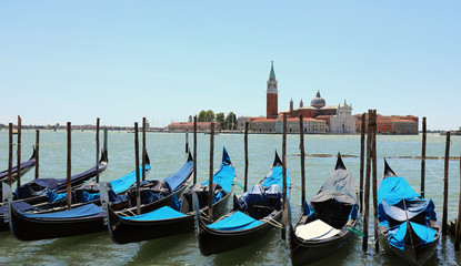 many gondolas moored on the Venetian Lagoon