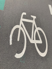Bicycle sign on asphalt street