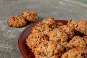 Cookies arranged on a brown plate on a wooden table