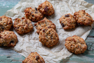 Cookies placed on paper on a wooden table
