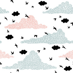 Seamless pattern with birds and clouds
