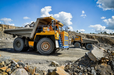 Zhodzina, Belarus - August 16, 2013: Granite mining in Quarry Trucks quarry of BelAZ