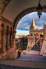 Fisherman's bastion - beautiful view during sunset in Budapest. Sandy Fairy Tales towers with clouds in the background.