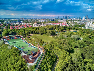 A beautiful panoramic view of the sunset in a fabulous evening on Szczesliwice Park - a former village, currently a housing estate in the Ochota district in Warsaw, Poland - obrazy, fototapety, plakaty