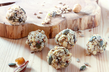 Fototapeta na wymiar Home cooking dates energy homemade organic seeds nuts vegan oatmeal balls wooden rustic background