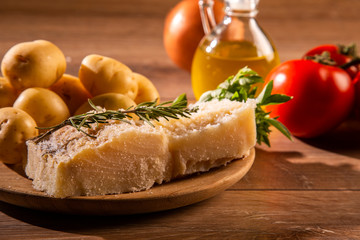 salted codfish on the wooden table with ingredients. Codfish raw.
