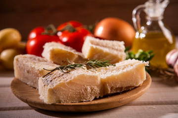 salted codfish on the wooden table with ingredients. Codfish raw.