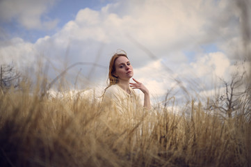 young woman in a field