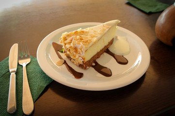 A plate with delicious cheesecake in a cafeon a table