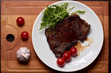 meat cooked in foil on a wooden board