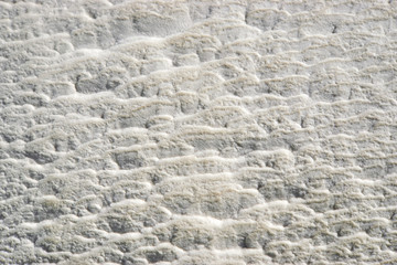 White texture of a geological rock. Shiny texture of calcium and salt, close-up.