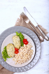 Diet chicken cutlets with oatmeal porridge. Concept of healthy food. Copy of the space.