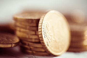 Euro coin on stock chart. Selective focus. Macro image.