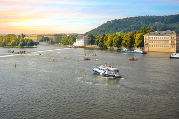 A busy day as boats and rafts cruise the Vltava River and appear on a rescue mission near the...