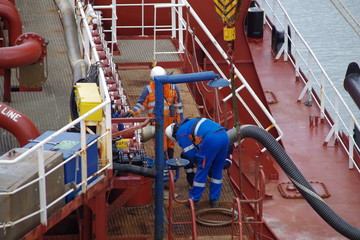 Seamen during connecting cargo hose