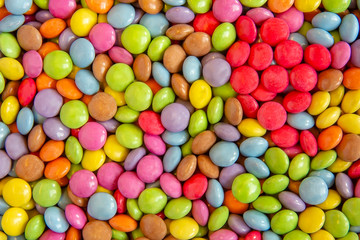 Fototapeta na wymiar Close up view of a multicolore sweet round candies display in a grocery shop