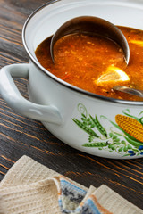 Red soup with vegetables and meat, tasty, traditional Ukrainian borsch, close-up, shallow depth of field, selective focus. Healthy Organic Homemade Food Concept