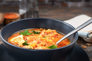 Red soup with vegetables and meat, tasty, traditional Ukrainian borsch, close-up, shallow depth of field, selective focus. Healthy Organic Homemade Food Concept