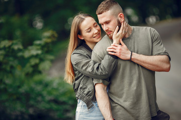 Fototapeta premium Couple in a forest. Man in a green t-shirt