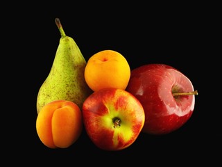 Varied fruits on black background