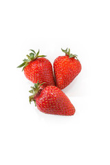 strawberry with green tails on a white background