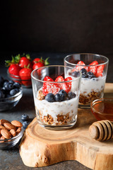 Granola parfait with oat cereal, fresh berries and greek yogurt