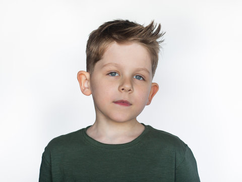 beautiful little boy with stylish haircut, isolate on white background, closeup portrait