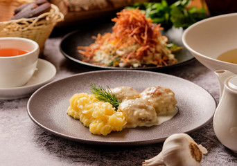 set of various plates of food top view, lunch. Spaghetti pasta carbonara, salad, meatballs, mashed potatoes, traditional creamy gravy, bread, tea. Healthy and mouth-watering three variation lunch.