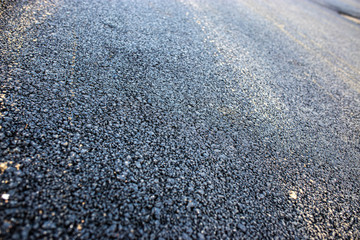 new and old asphalt on the road..