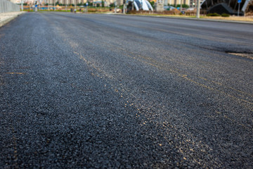 new and old asphalt on the road..