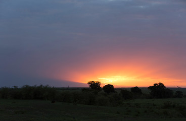 A beautiful Landscape of Masai Mara during sunset with dense cloud