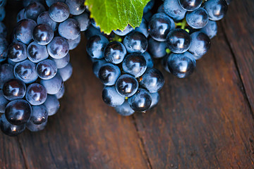 Grapes on a wooden barrel