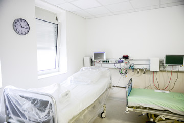 Intensive care unit with monitors prepared to receive corona, covid patient