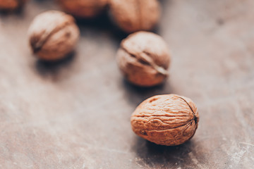 Walnuts on a wooden table. Macro image.