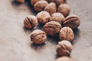 Walnuts on a wooden table. Macro image.
