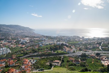 Fototapeta na wymiar View of Funchal city and the ocean from Pico dos Barcelos lookout point, Madeira