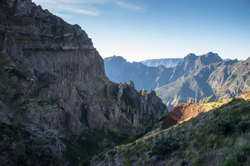 Fototapeta na wymiar Panorama of the rugged hills in the hiking trail between Pico Ruivo and Pico do Arieiro, Madeira