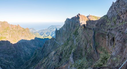 Fototapeta premium Panorama of the rugged hills in the hiking trail between Pico Ruivo and Pico do Arieiro, Madeira