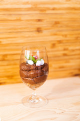 Glass filled with mousse chocolate and toppingsGlass filled with mousse chocolate and toppings