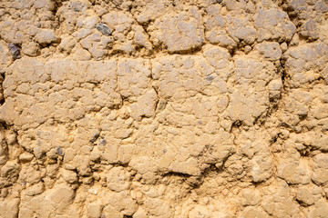 Clay wall texture surface of the old house in countryside walls made of clay is popular in rural mountain areas in Asia. Concept textured space building background