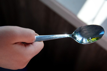 Spoon in the child's hand