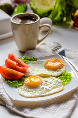 Fried eggs from two eggs on a plate