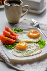Fried eggs from two eggs on a plate