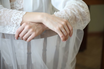 Beautiful hands, hands of the bride in wedding dress