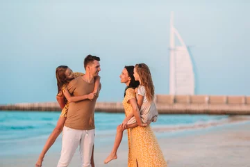 Crédence de cuisine en verre imprimé Dubai Happy family on the beach during summer vacation