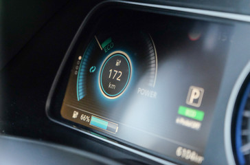 detail of dashboard and speedometer of electric car. You can see the remaining battery charge and...