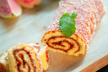 Bolo de Rolo (Swiss roll, Roll cake) typical Brazilian dessert, from the northeast region. Sliced ​​cake roll with guava paste.